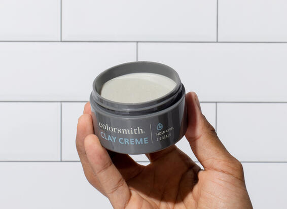 applying clay crème paste to hair