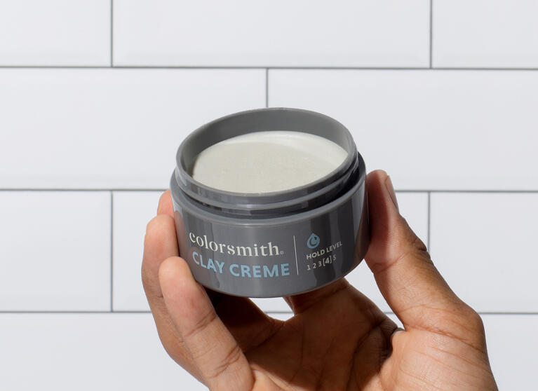applying clay crème paste to hair